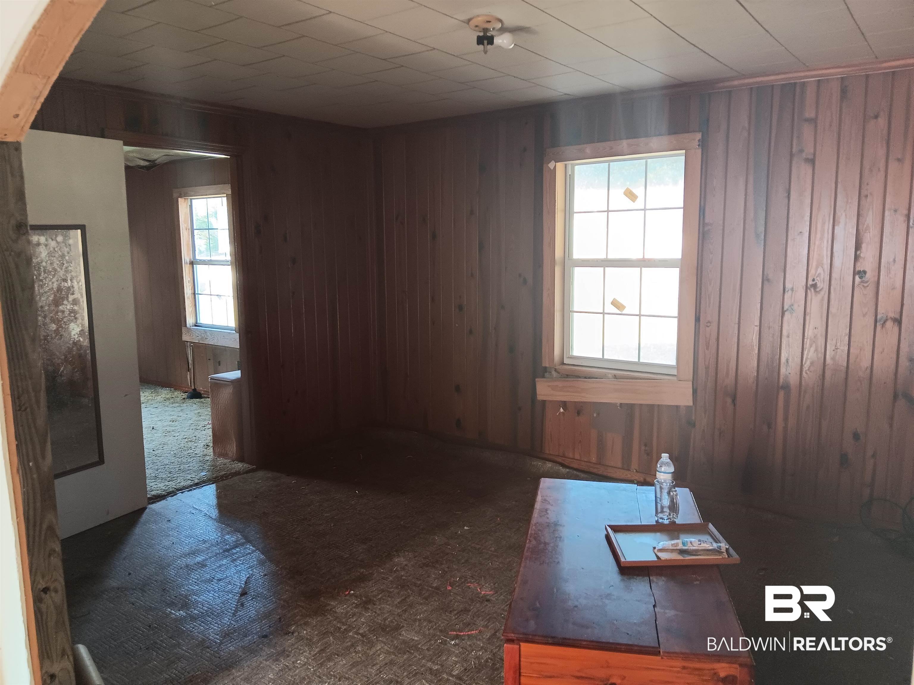61 Katherine Street Flomaton, AL 36441 - Photo 5 of 13 Unfurnished room with wood walls
