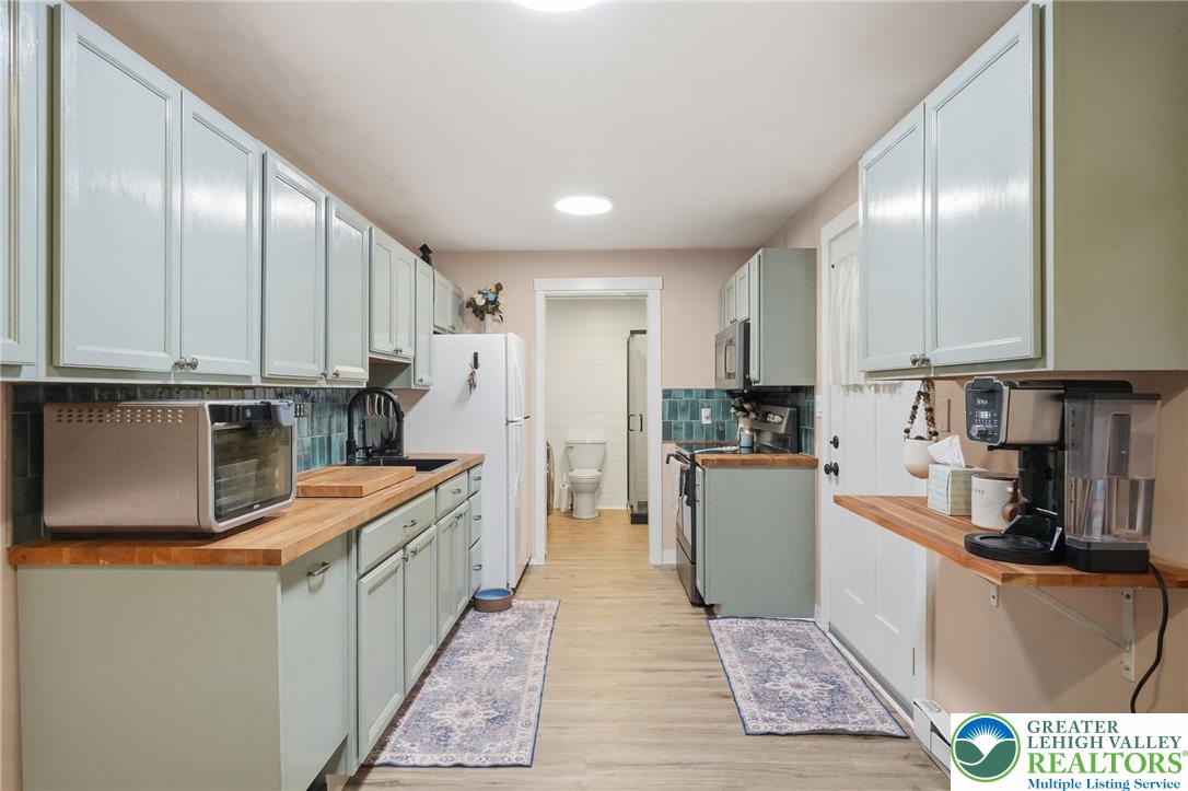 9033 Loop Road Slatington, PA 18080 - Photo 20 of 53 Culinary delights await in this bright kitchen with ample cabinetry and robust wood counters.