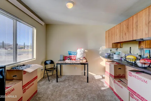 a bedroom with furniture and a dresser