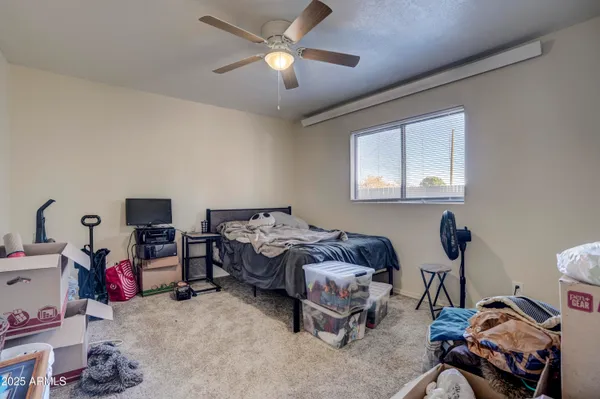 a bedroom with furniture and a bed
