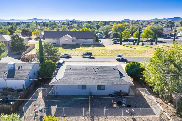 an aerial view of a house with swimming pool and ocean view