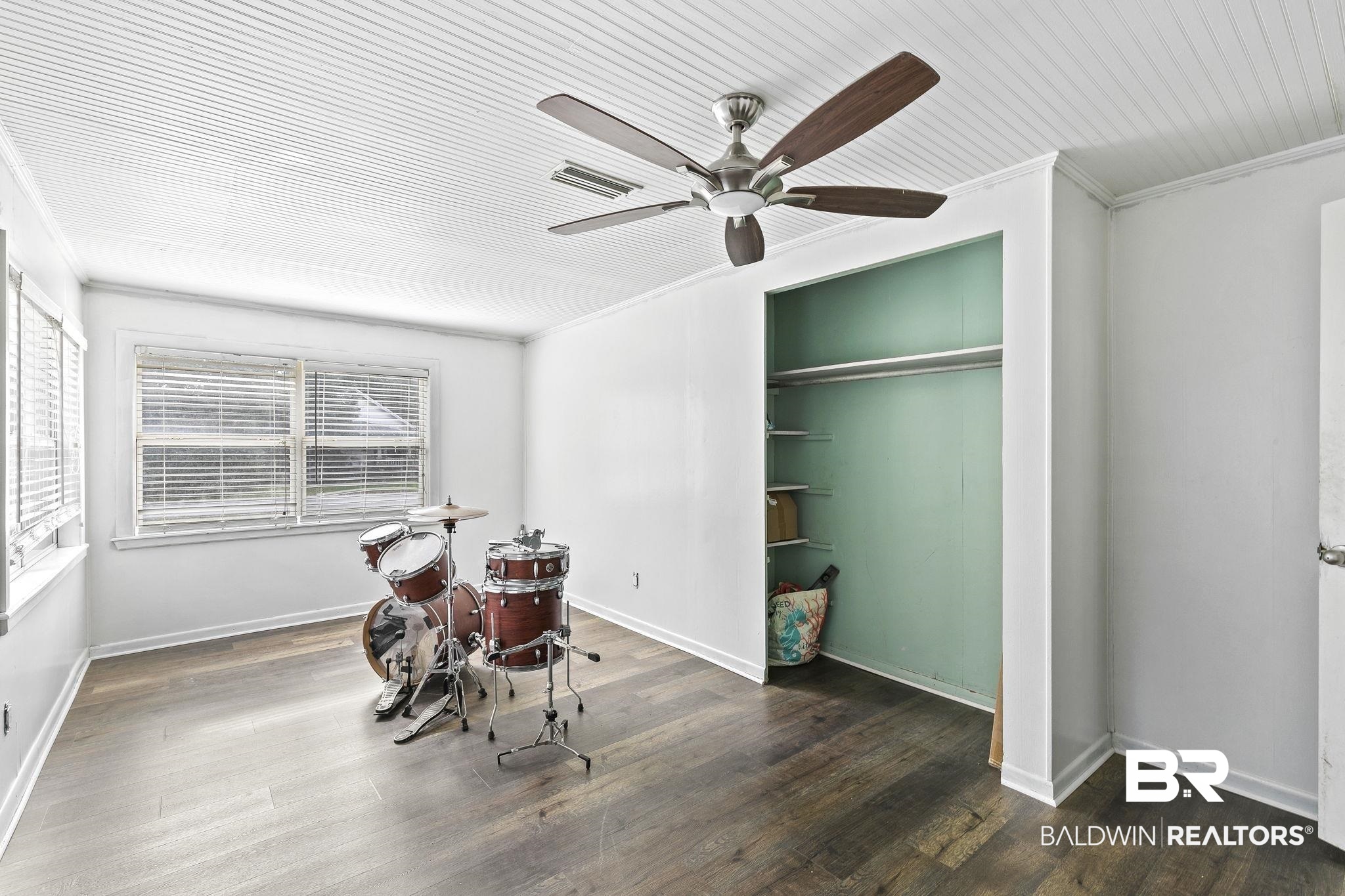316 West Orchid Avenue Foley, AL 36535 - Photo 36 of 38 Playroom with crown molding, dark wood finished floors, and ceiling fan