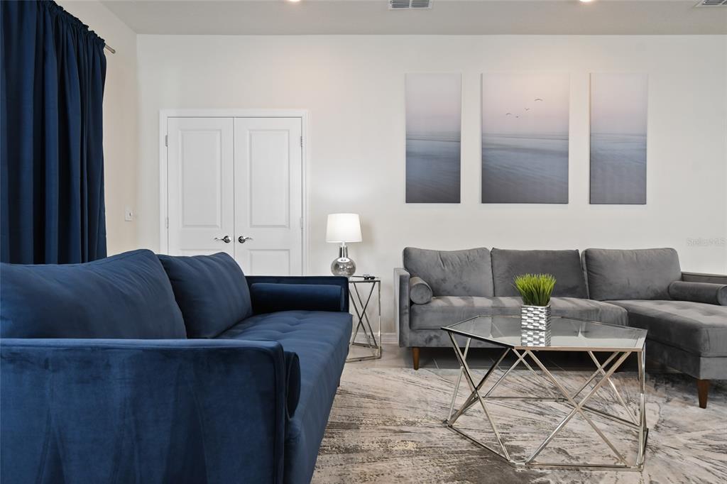 4428 Kaipo Road Davenport, FL 33897 - Photo 14 of 73 a living room with furniture and a window