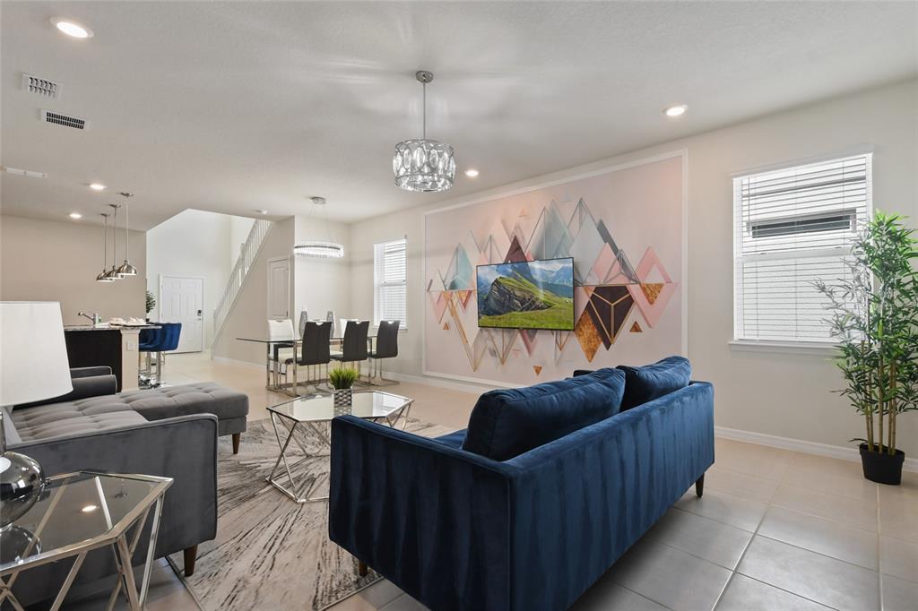 4428 Kaipo Road Davenport, FL 33897 - Photo 17 of 73 a living room with furniture and a large window