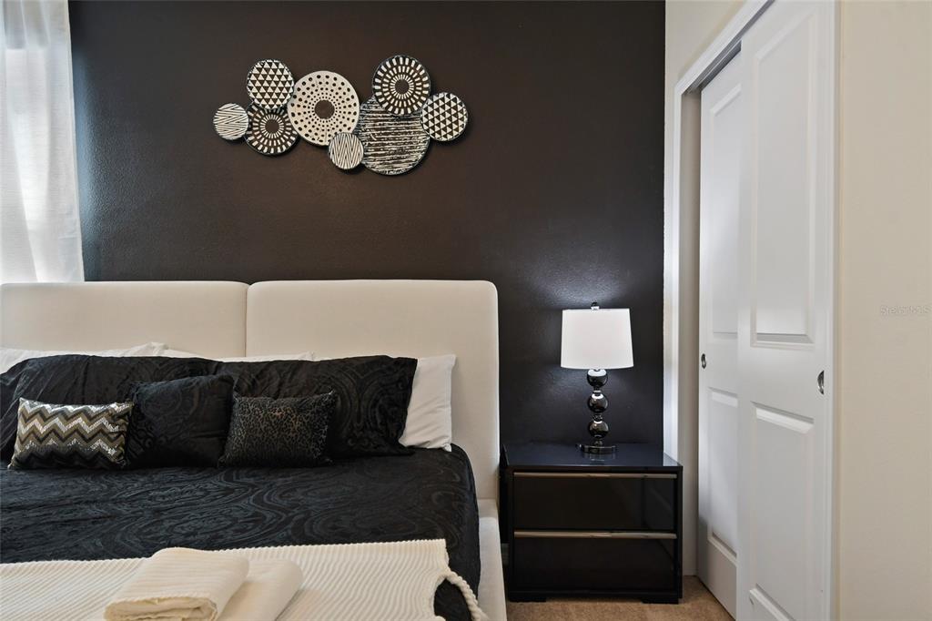 4428 Kaipo Road Davenport, FL 33897 - Photo 21 of 73 a living room with furniture flowerpot and window