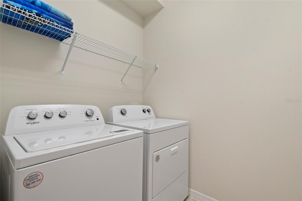 4428 Kaipo Road Davenport, FL 33897 - Photo 23 of 73 a utility room with dryer and washer