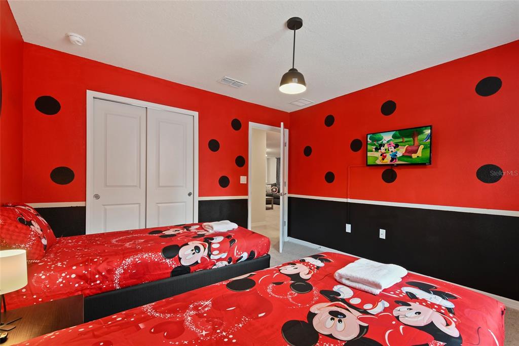 4428 Kaipo Road Davenport, FL 33897 - Photo 40 of 73 a bedroom with a bed and a window