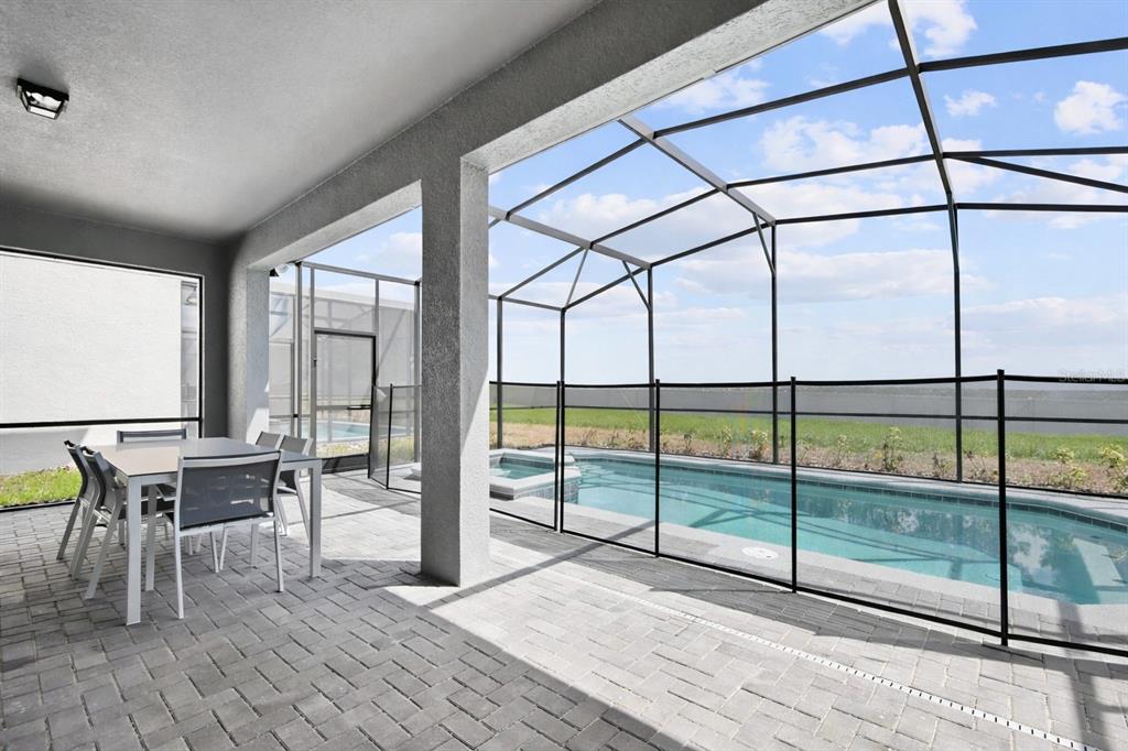 4428 Kaipo Road Davenport, FL 33897 - Photo 52 of 73 a view of livingroom with furniture and floor to ceiling window