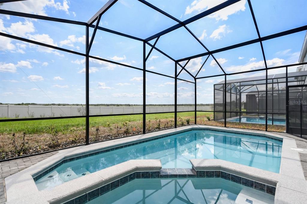 4428 Kaipo Road Davenport, FL 33897 - Photo 53 of 73 a view of a swimming pool with a from a chair