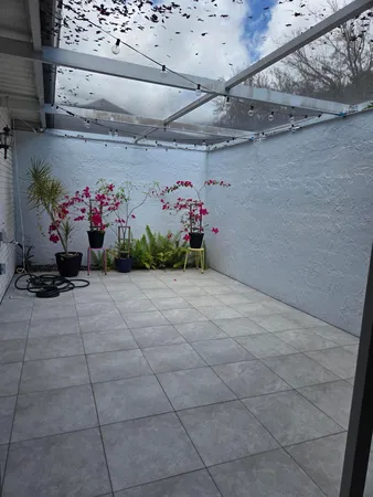 a kitchen with granite countertop white cabinets and stainless steel appliances