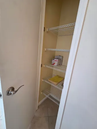 a view of a livingroom with furniture and a window
