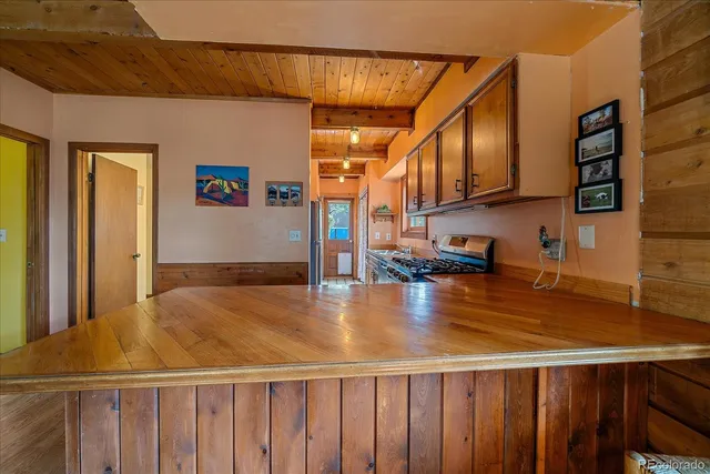 a kitchen with stainless steel appliances granite countertop a sink and cabinets