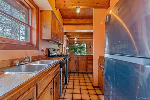 a kitchen with a sink and a large window