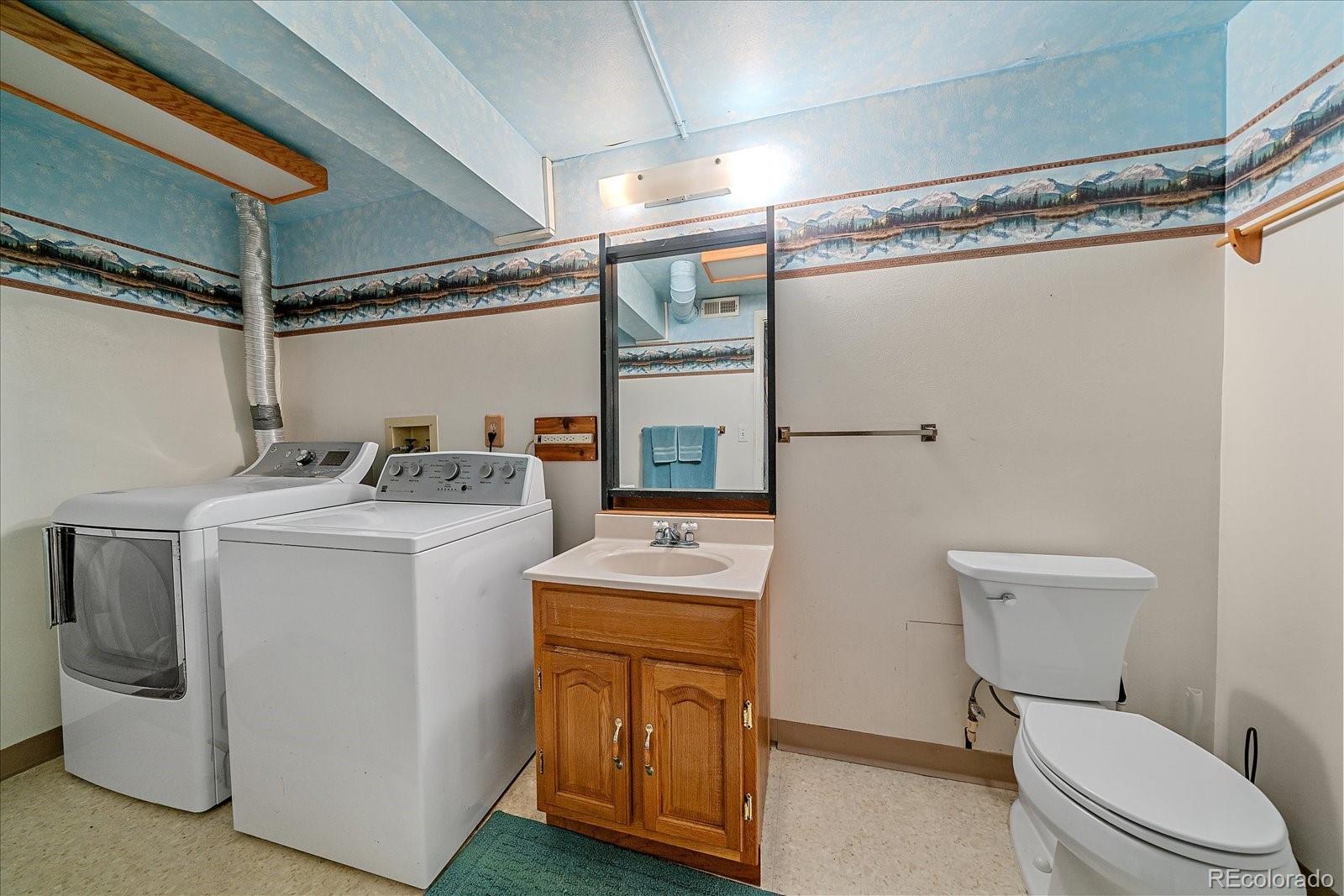 104 Six Bits Street Bailey, CO 80421 - Photo 24 of 46 a utility room with dryer and washer