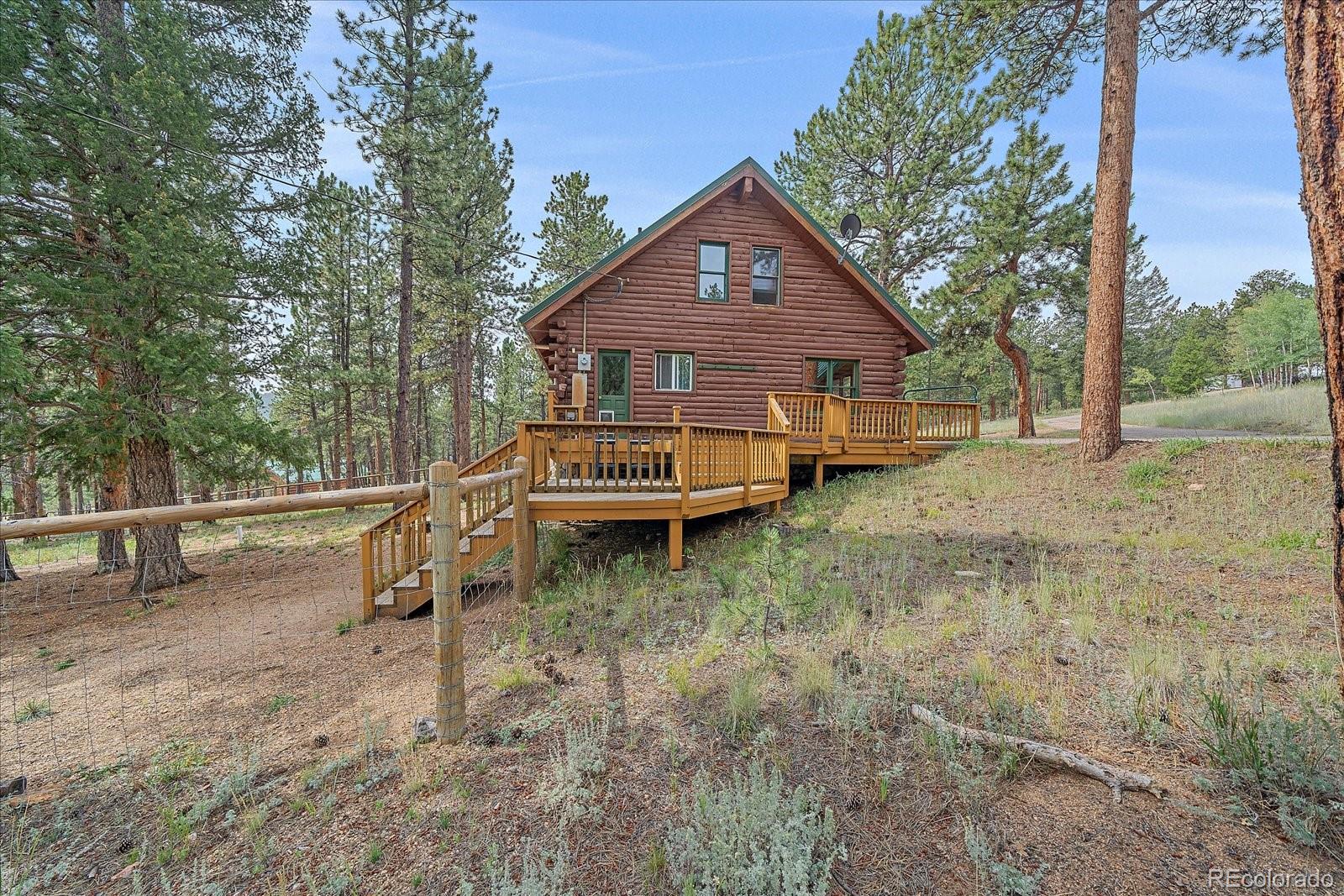 104 Six Bits Street Bailey, CO 80421 - Photo 28 of 46 a view of a house with a yard