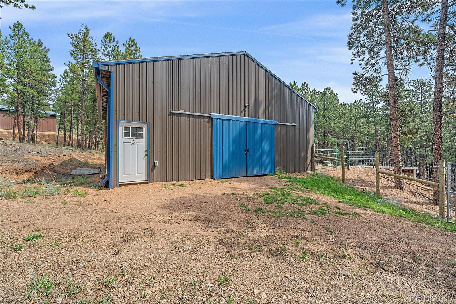 104 Six Bits Street Bailey, CO 80421 - Photo 30 of 46 a house with a yard