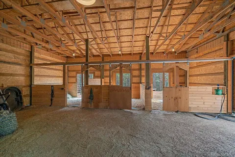 a view of an empty room with windows