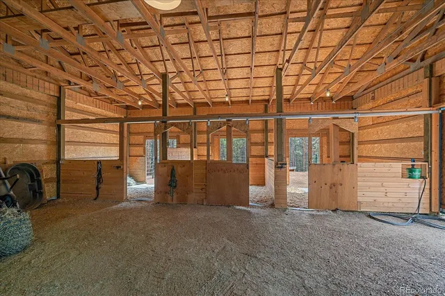 a view of an empty room with windows