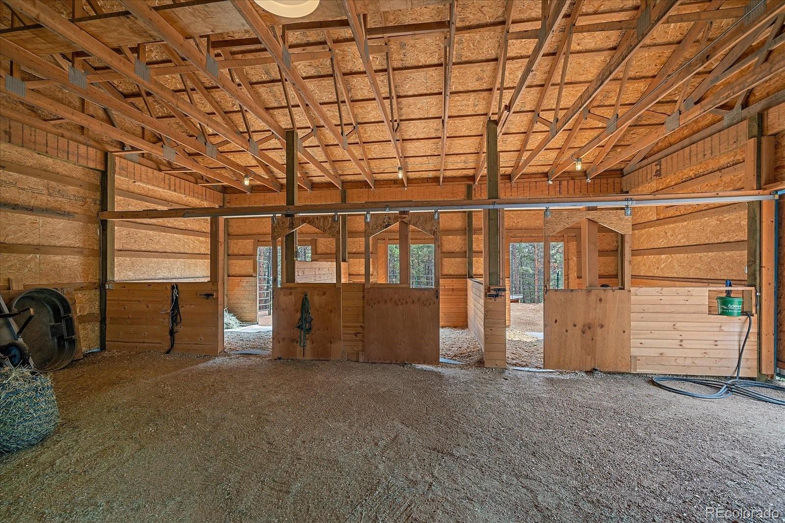 104 Six Bits Street Bailey, CO 80421 - Photo 32 of 46 a view of an empty room with windows