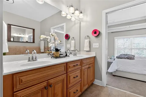 a bathroom with a sink vanity and a mirror