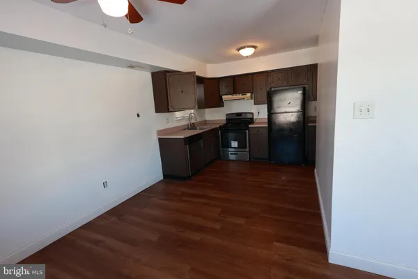 a kitchen with stainless steel appliances a refrigerator and a stove