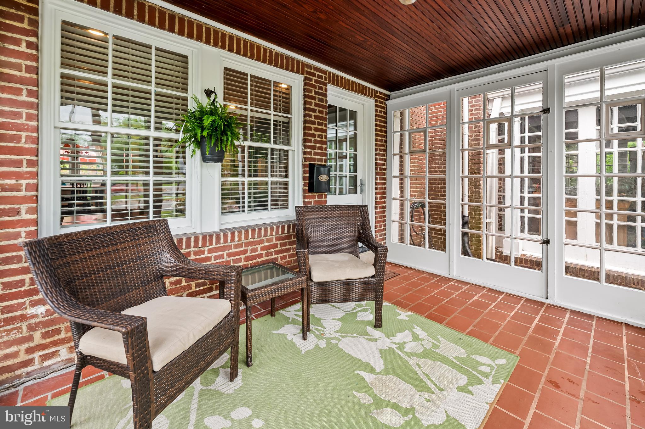 4308 Roland Avenue Baltimore, MD 21210 - Photo 3 of 34 a balcony with furniture and wooden floor