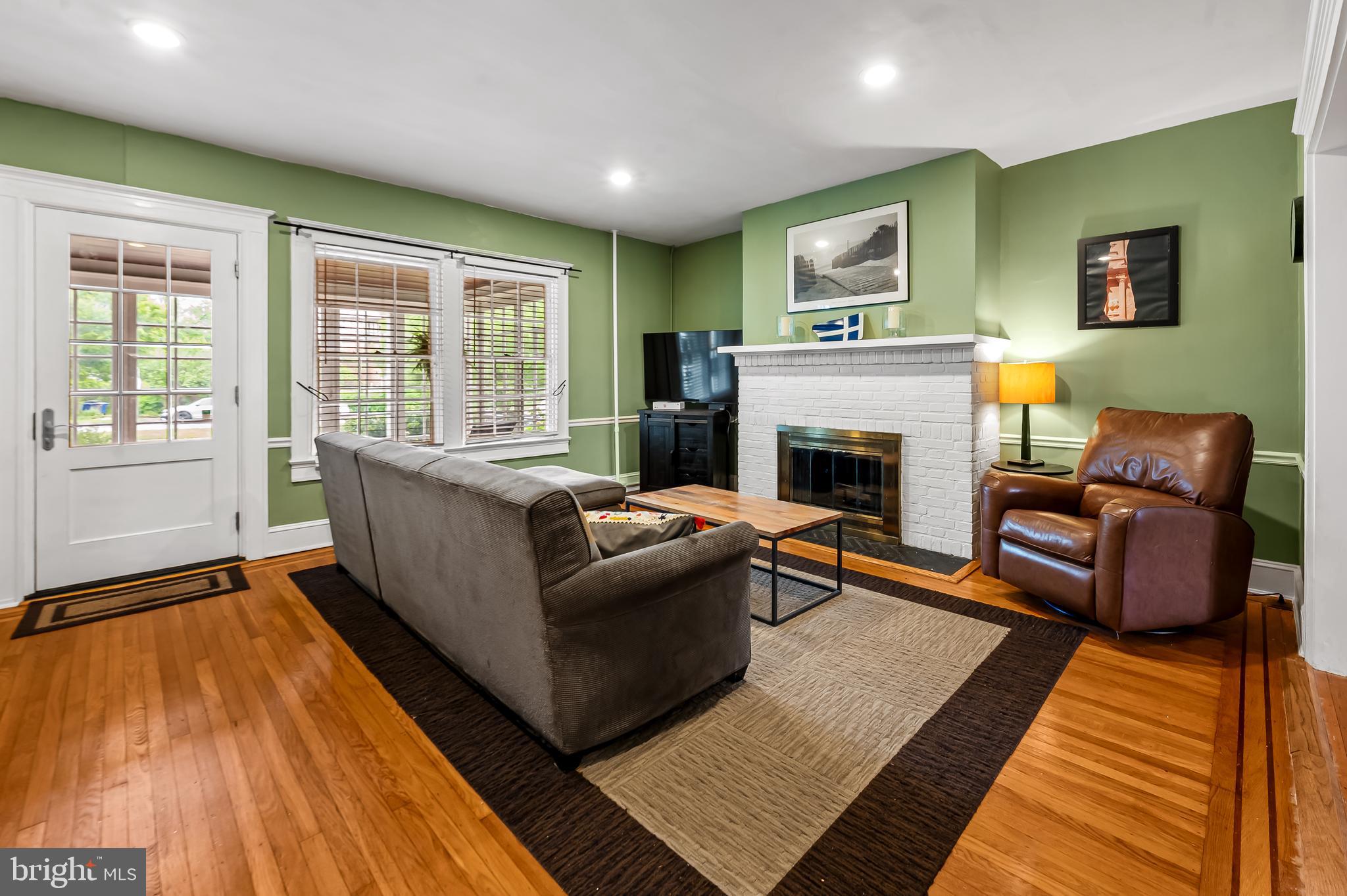 4308 Roland Avenue Baltimore, MD 21210 - Photo 5 of 34 a living room with furniture and a fireplace