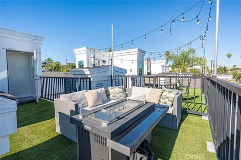 a view of a patio with couches chairs dining table and chairs