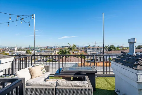 a view of a balcony with furniture