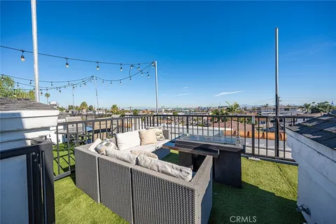 a view of a balcony with furniture