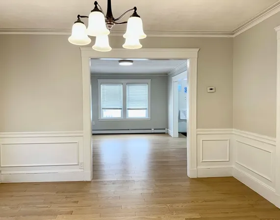 a view of a livingroom with wooden floor
