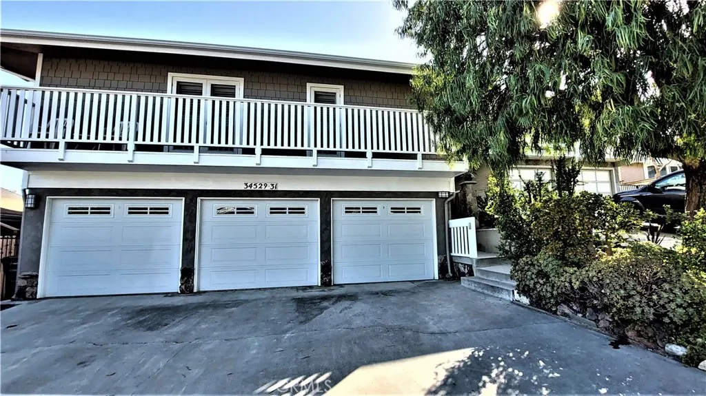 34529 Via Verde Dana Point, CA 92624 - Photo 1 of 18 a view of a house with a yard and deck
