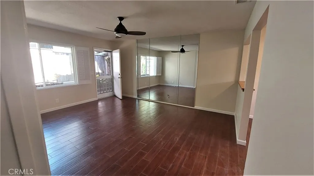 34529 Via Verde Dana Point, CA 92624 - Photo 11 of 18 an empty room with wooden floor and windows