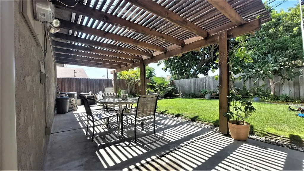 34529 Via Verde Dana Point, CA 92624 - Photo 15 of 18 a view of a patio with a table chairs and a backyard