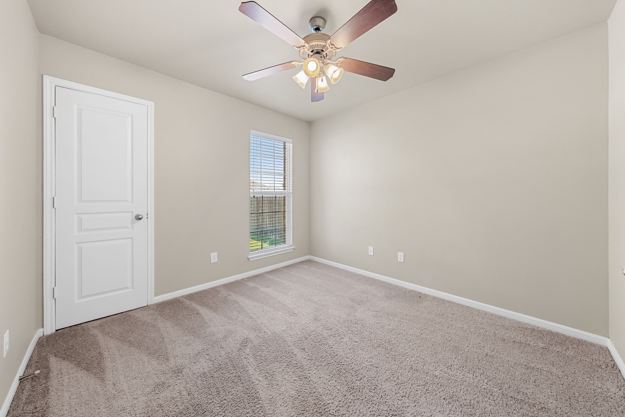 7719 Fieldstone Drive Temple, TX 76502 - Photo 8 of 37 Empty room with light colored carpet and a ceiling fan