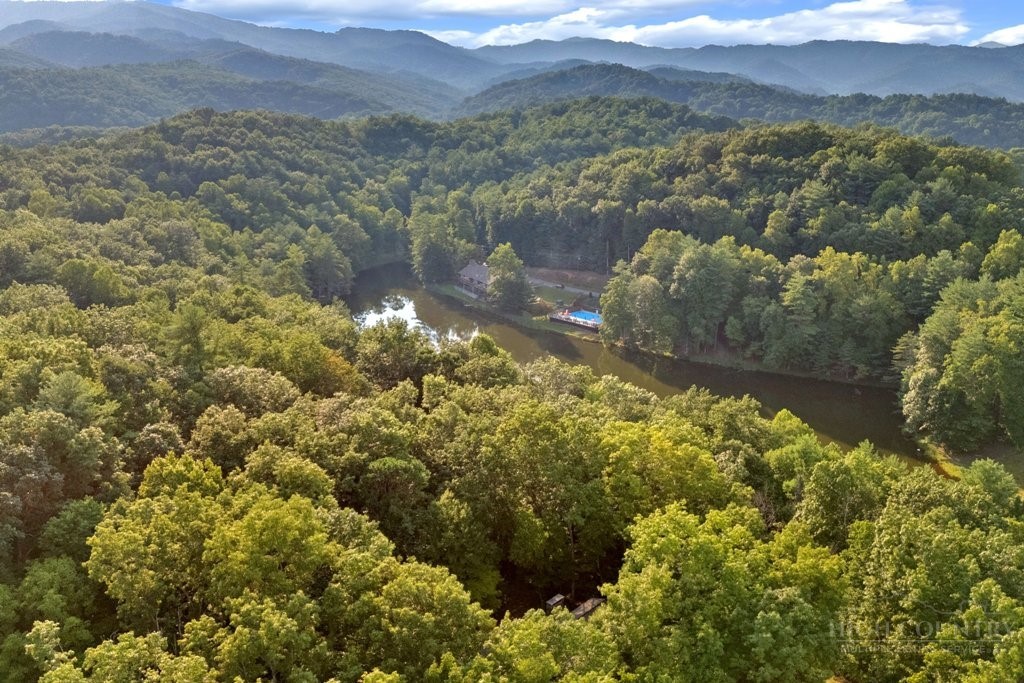 467 Horseshoe Ridge Road East Deep Gap, NC 28618 - Photo 35 of 46 a view of a lake with mountains in the background