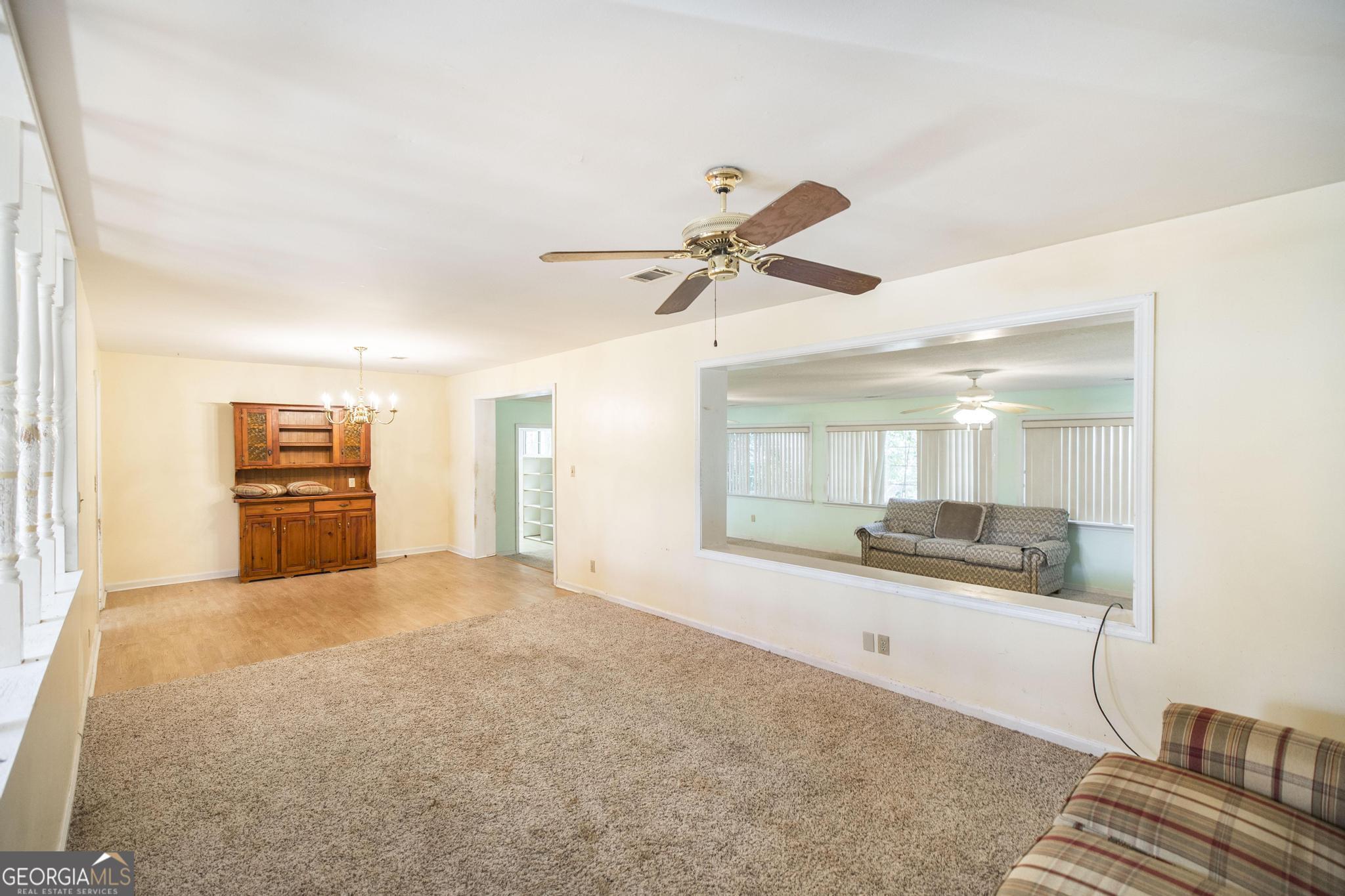 1739 Houston Lake Road Perry, GA 31069 - Photo 16 of 34 a living room with stainless steel appliances kitchen island granite countertop furniture and a kitchen view