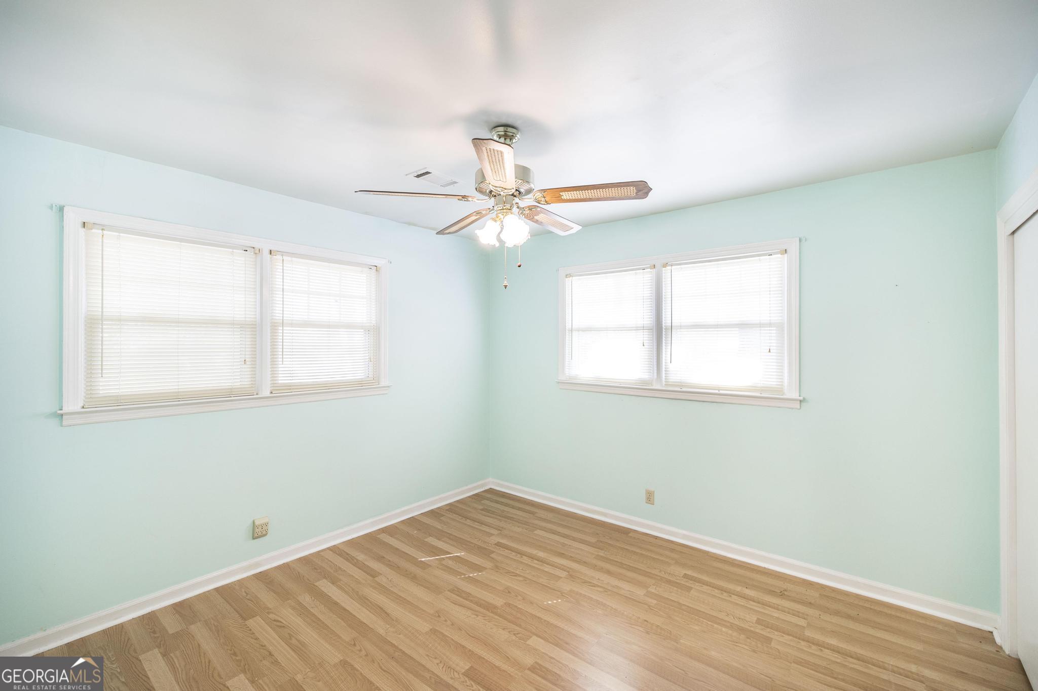 1739 Houston Lake Road Perry, GA 31069 - Photo 25 of 34 a view of a room with a ceiling fan and a window