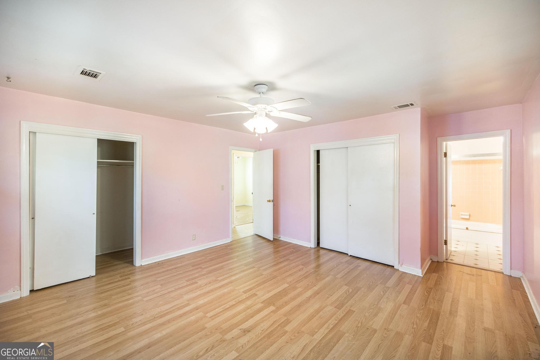 1739 Houston Lake Road Perry, GA 31069 - Photo 28 of 34 a view of an empty room with wooden floor