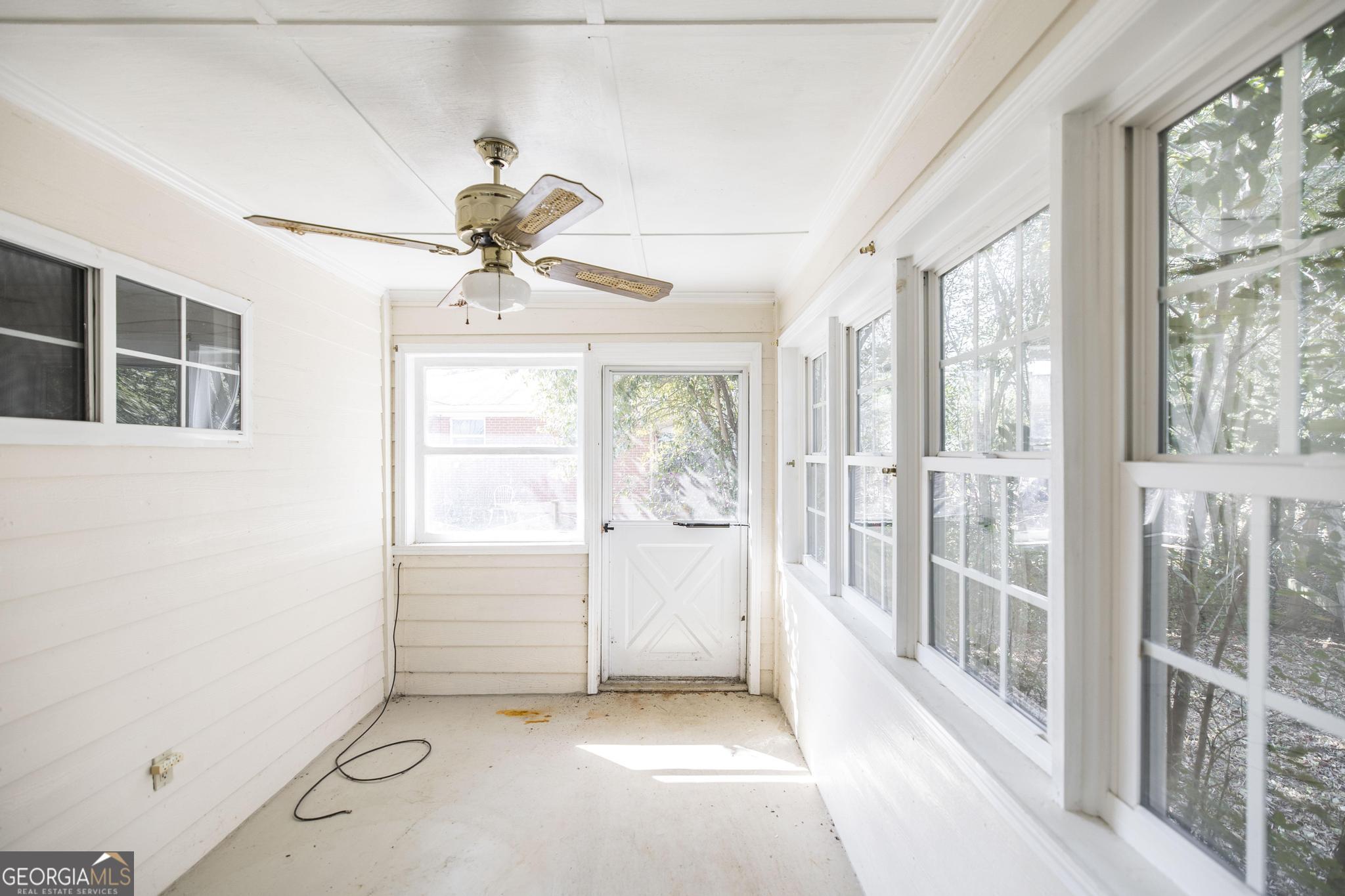1739 Houston Lake Road Perry, GA 31069 - Photo 31 of 34 wooden floor in an empty room with a window