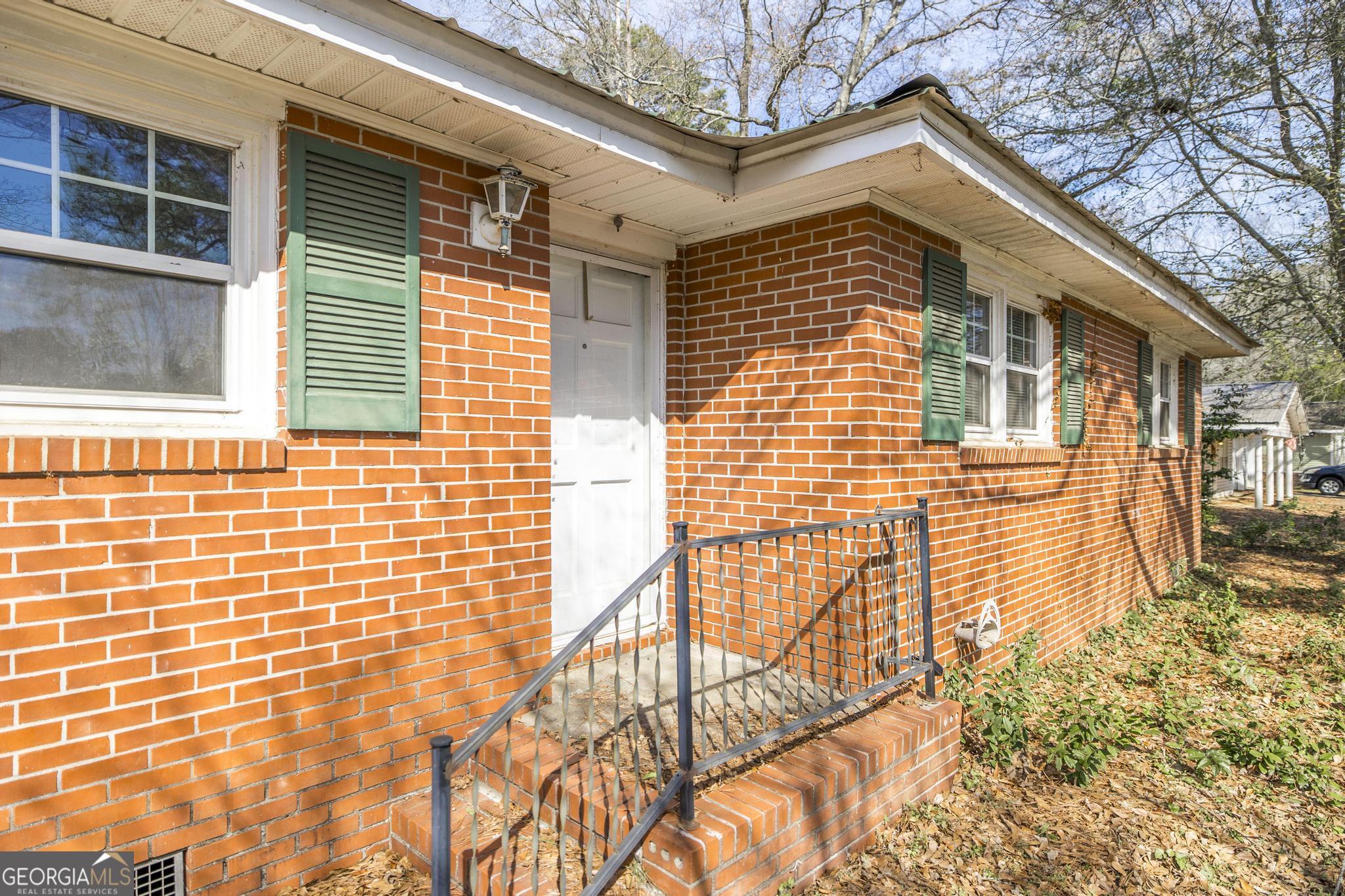 1739 Houston Lake Road Perry, GA 31069 - Photo 5 of 34 a front view of a house