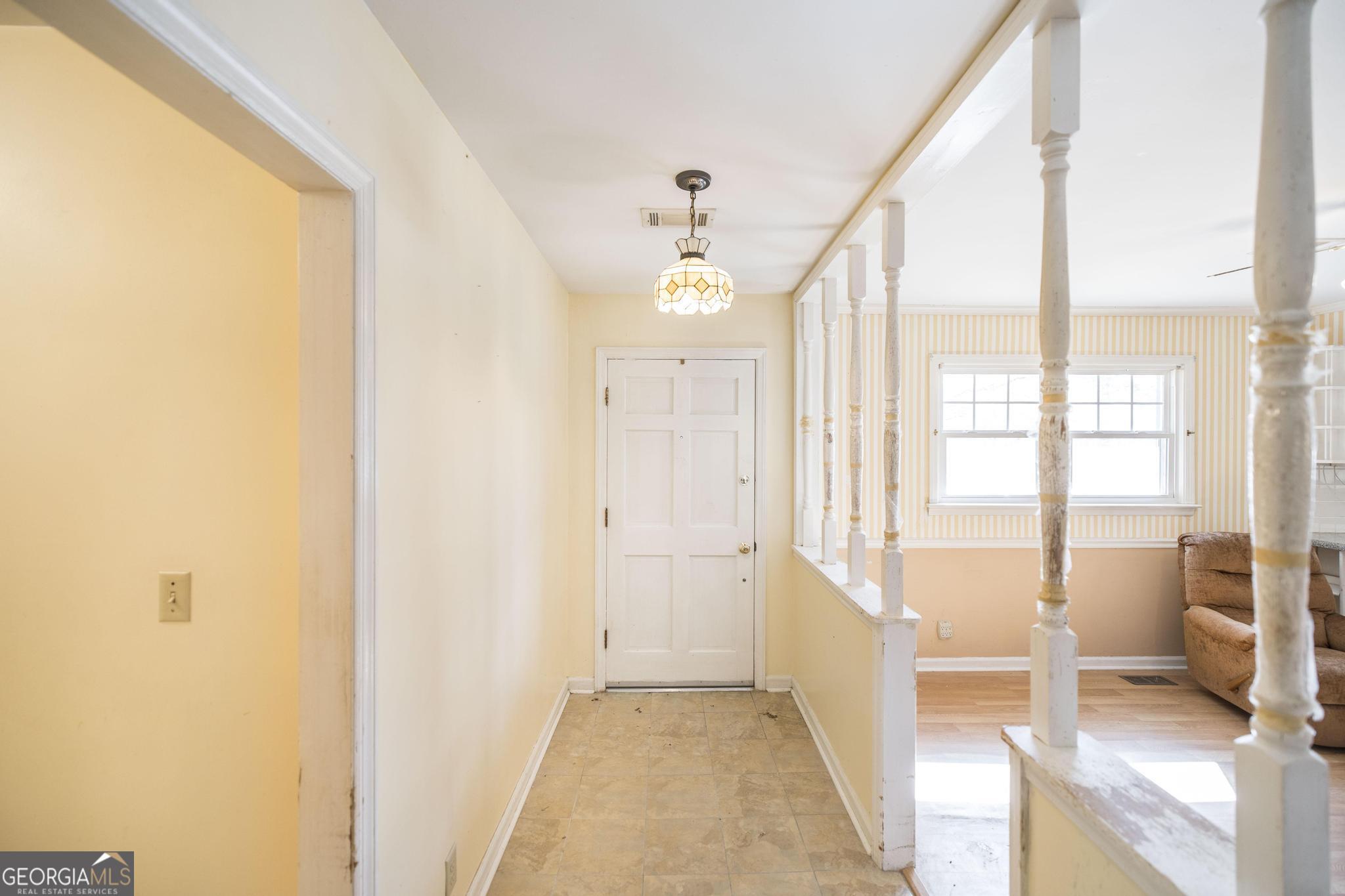 1739 Houston Lake Road Perry, GA 31069 - Photo 6 of 34 a view of an entryway with a floor to ceiling window