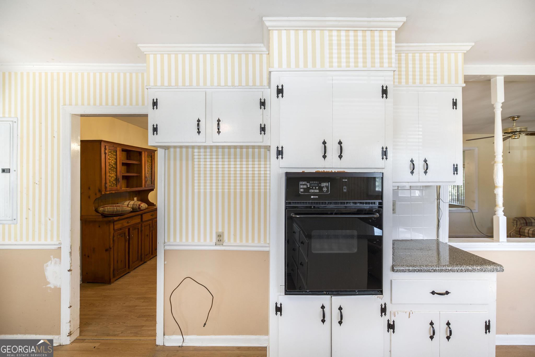 1739 Houston Lake Road Perry, GA 31069 - Photo 10 of 34 a kitchen with stainless steel appliances granite countertop a stove a sink and a refrigerator