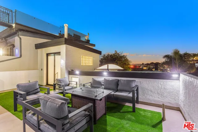 a view of an outdoor sitting area in a yard