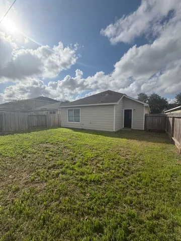 a house view with swimming pool in front of it
