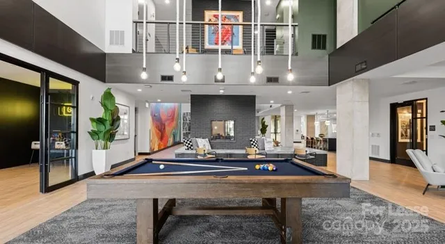 a living room with fireplace furniture and a table