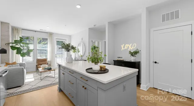a kitchen with sink and refrigerator