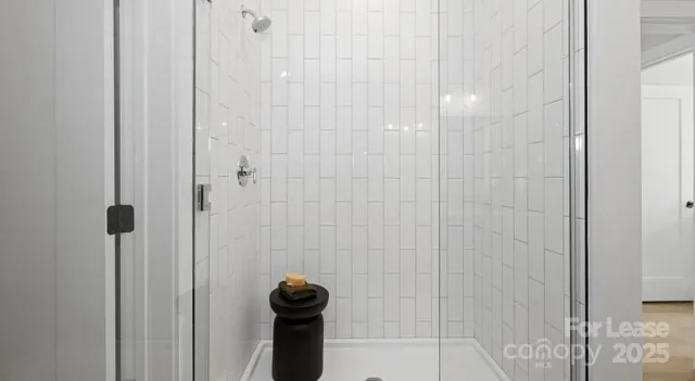 a spacious bedroom with a bed and a couch