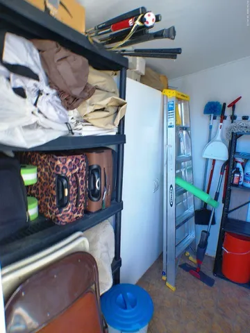 a living room with patio furniture and a large window