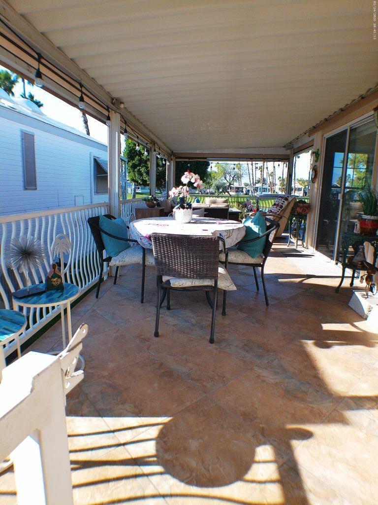 84136 Ave 44, Unit 262 Indio, CA 92203 - Photo 15 of 60 a view of a patio with a table chairs and a patio